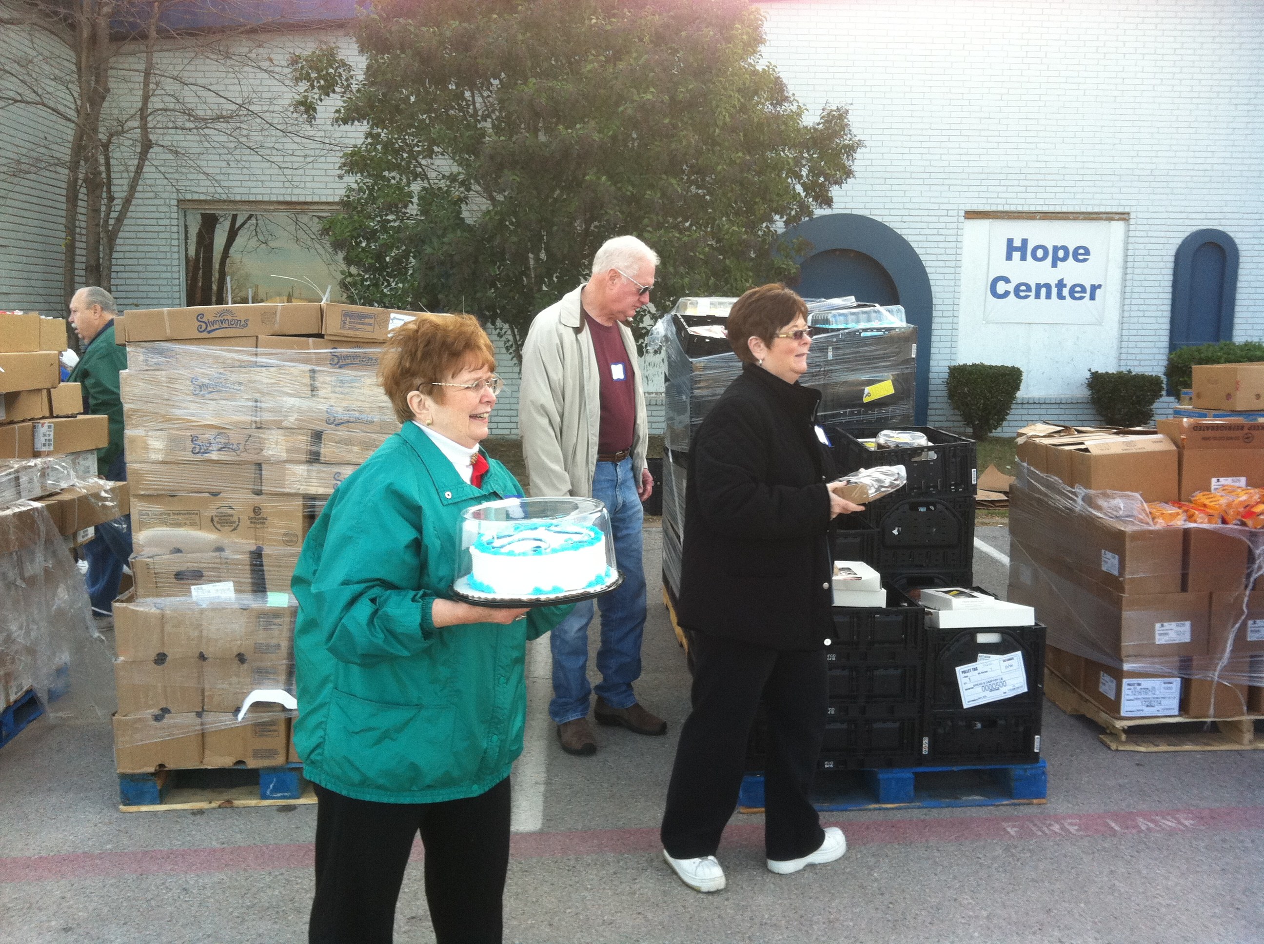 Volunteers with food at a Fort Worth Hope Center outreach.