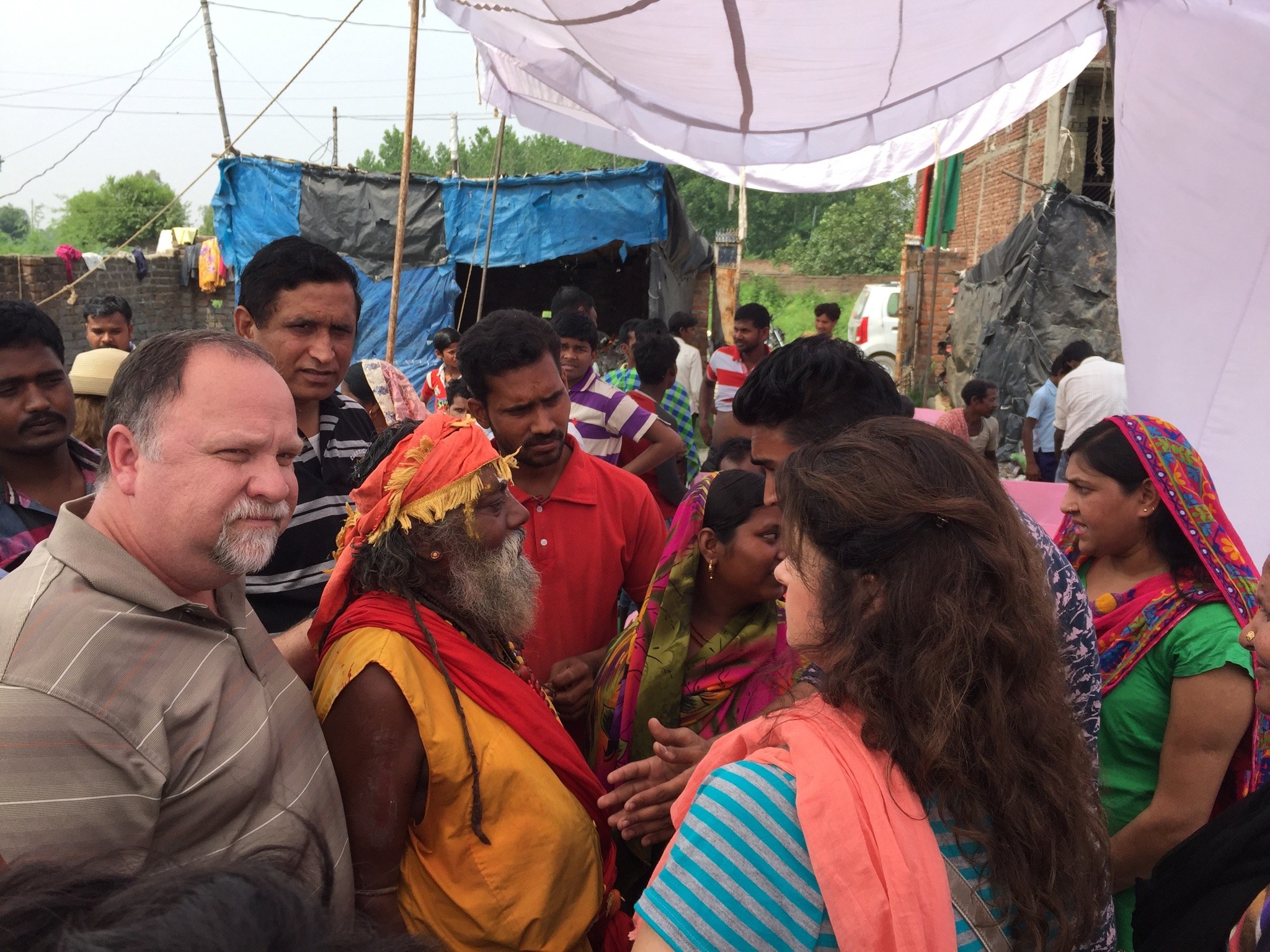 Bishop Dr. Jeffrey W. Larson with a crowd during a ministry visit in India.